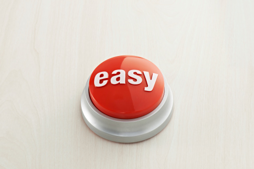 Easy button on wood background.