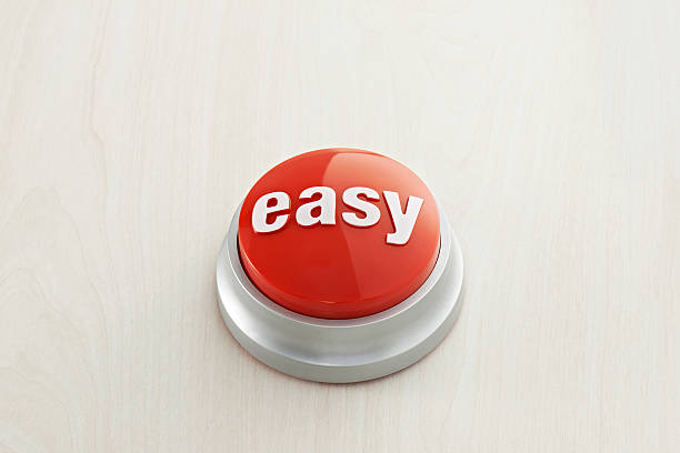 Easy Button Easy button on wood background. effortless stock pictures, royalty-free photos & images