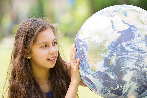 istock Child looking at planet earth, Africa in front 494598177