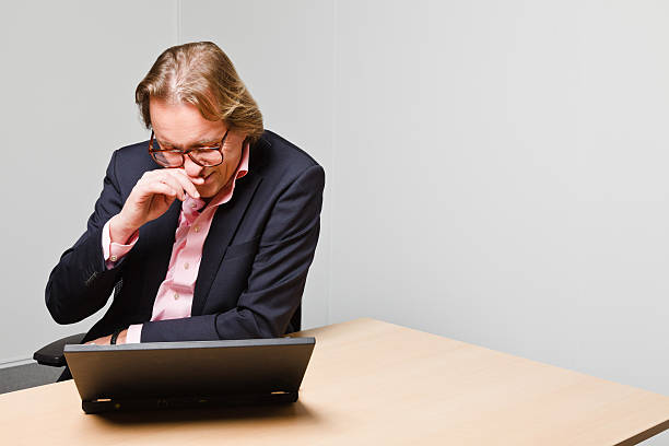 istock Young business man with blond hair working with laptop. 494598883