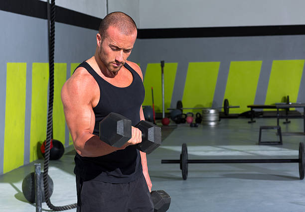istock Gym man with dumbbells exercise gym 494600667