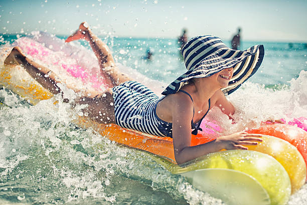 istock Little girl having fun on the inflateable raft 494600773