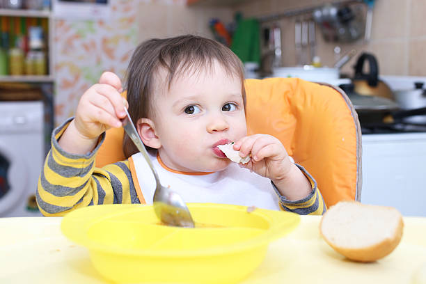 istock baby age of 1 year has dinner 494601407