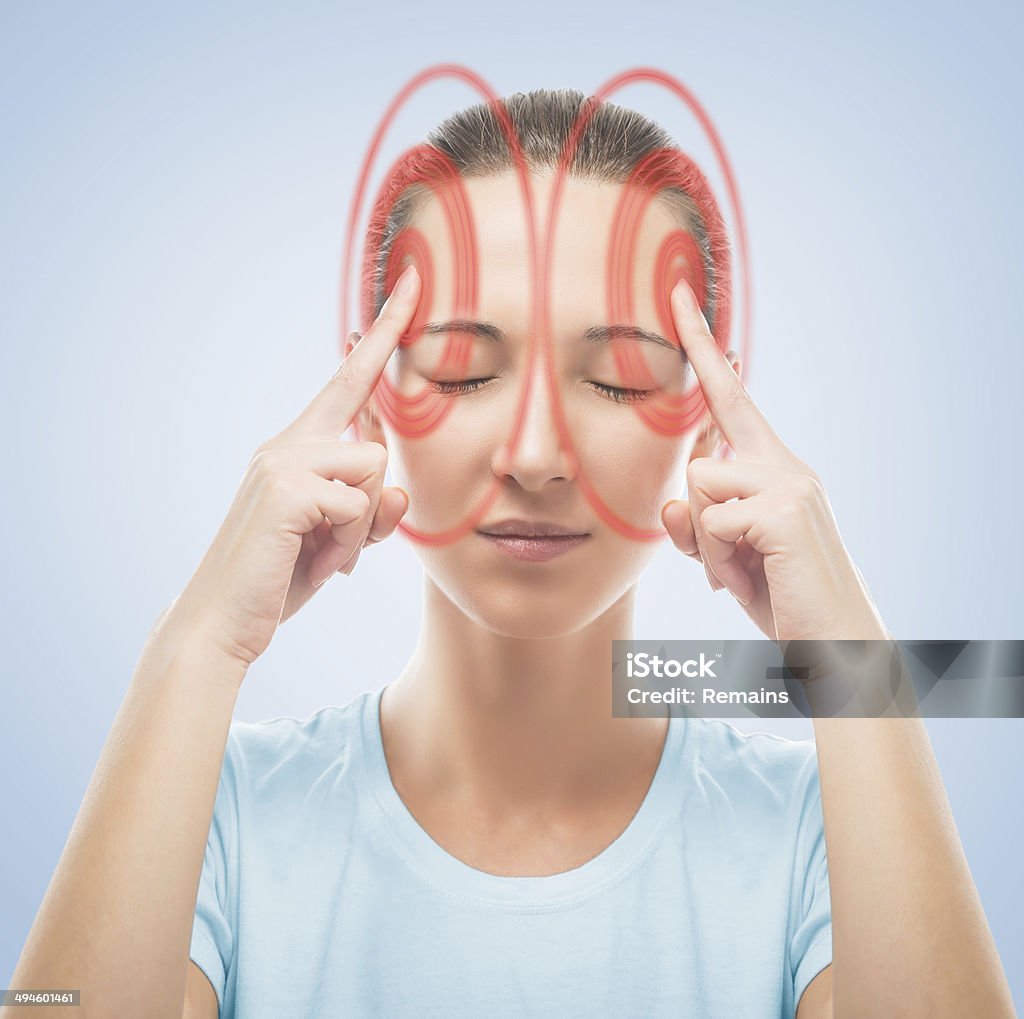 Woman touches her head, temporal region of red color Young woman touches her head, temporal region of red color, concept of headache Adult Stock Photo