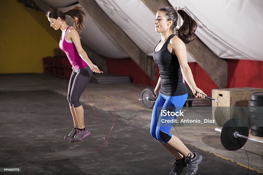 Workout with a jump rope Pretty athletic girls using jump ropes for her workout in a gym gym Jump Rope Stock Photo