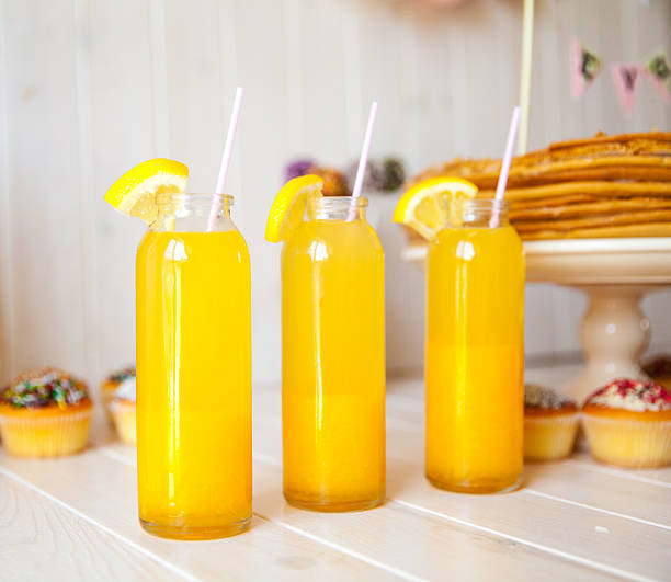 istock Fresh summer orange cocktails on wooden table 494604044