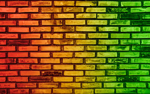 Abstract colors on brick wall background and reggae music