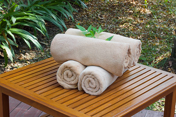 istock towels on wooden table 494606882