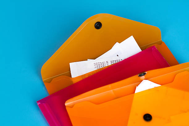 istock Colorful Filing System: Pink and Orange Plastic Folders with Receipts 494607482