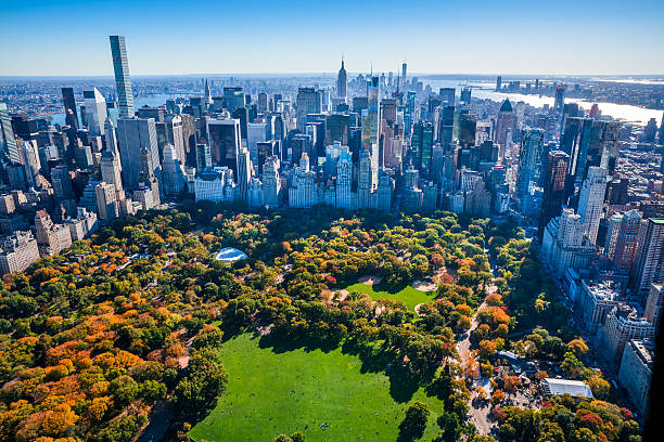 New York City Skyline, Central Park, autumn foliage, aerial view New York City skyline aerial view with Central Park in foreground and Manhattan cityscape skyline in background. Colorful autumn foliage in Central Park. central park manhattan stock pictures, royalty-free photos & images