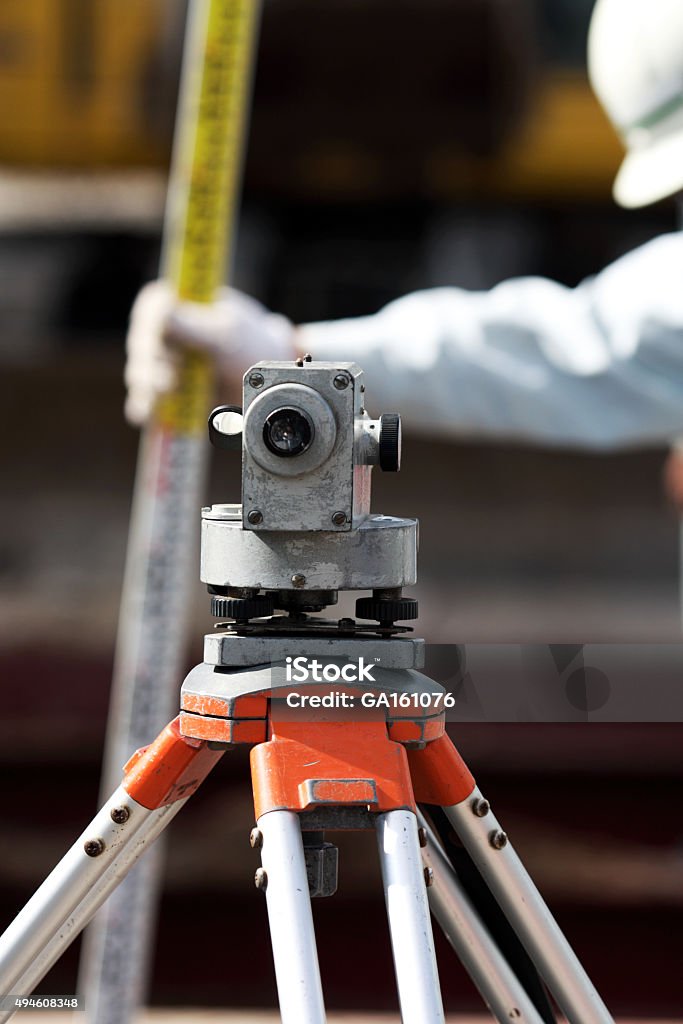 Engineers Dumpy Level Dumpy Level With Worker Behind Stock Photo - Download Image Now - 2015 ...