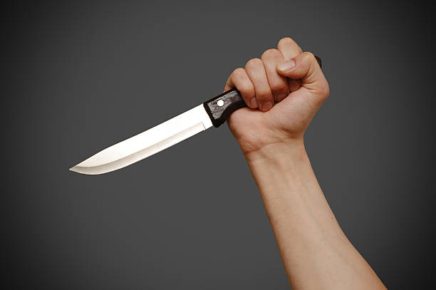 istock The man with a knife in a hand. Closeup 494610124