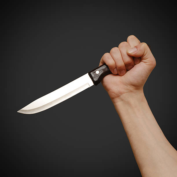 istock The man with a knife in a hand. Closeup 494610142