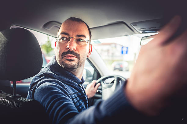 Portrait of a Man Driving a Car