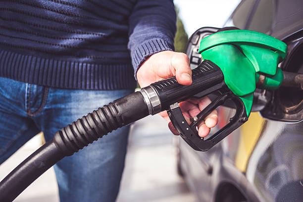 istock Man Refueling Vehicle, Close-up 494610690