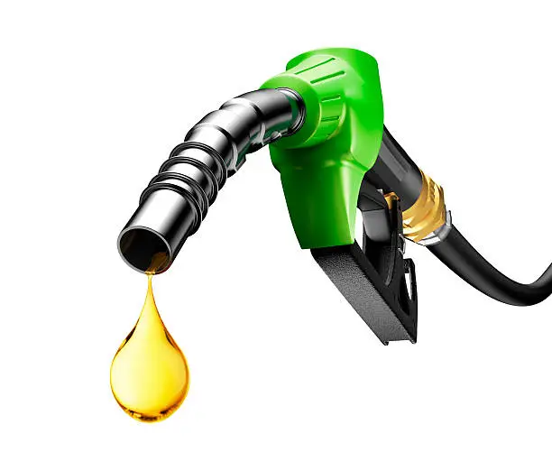 Oil dripping from a gasoline pump isolated on white background