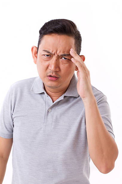 istock sick, stressful man suffering from headache, migraine 494613366
