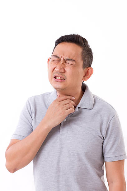 istock sick man suffering from sore throat 494613722
