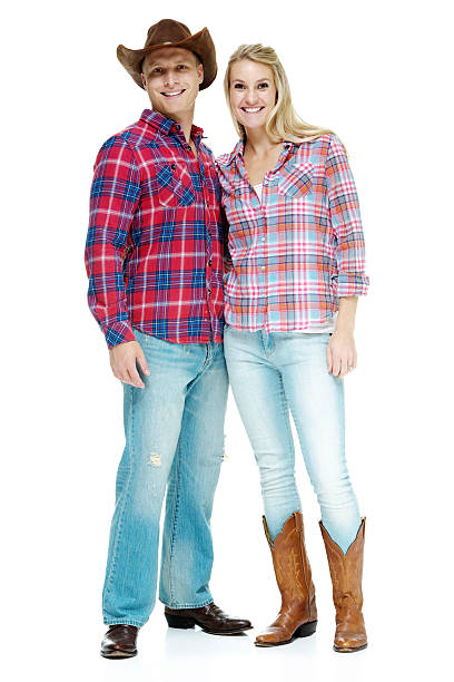 istock Smiling cowboy couple standing and looking at camera 494615010