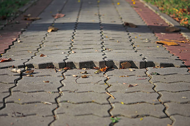 istock Surface of a broken cement brick pavement for textural backgroun 494616526