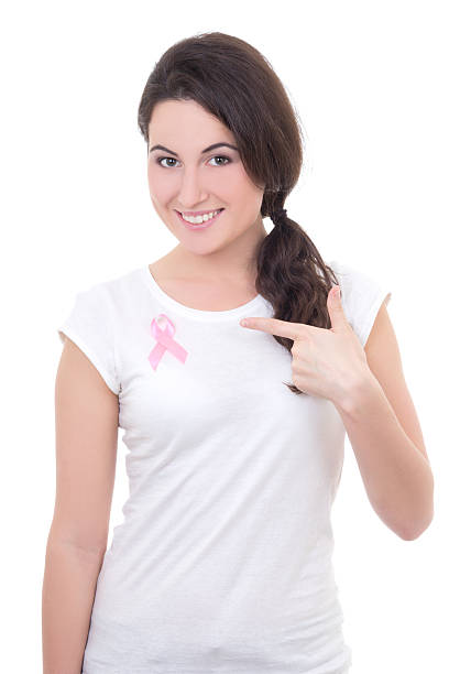 young woman with pink cancer ribbon on the breast stock photo