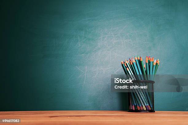 Concept Of Education Or Back To School On Green Background Stock Photo - Download Image Now
