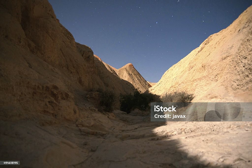 Hiking in night desert Adventure in dart Negev desert in Israel night Adventure Stock Photo