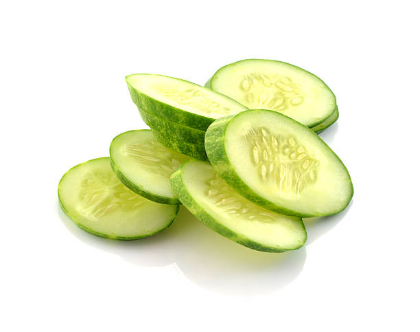 istock Slices of cucumber isolated on white 494619440