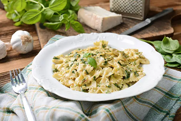 Farfalle pasta with fresh spinach and gorgonzola cheese