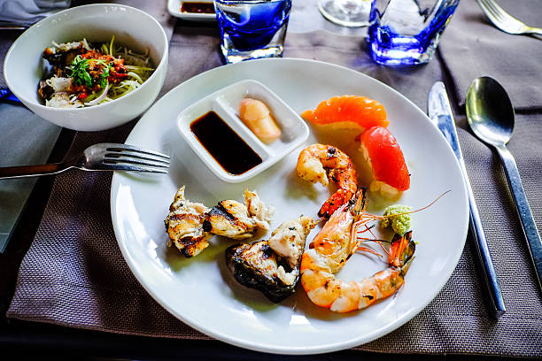 istock assorted sashimi and sushi seafood served on a white plate 494620185
