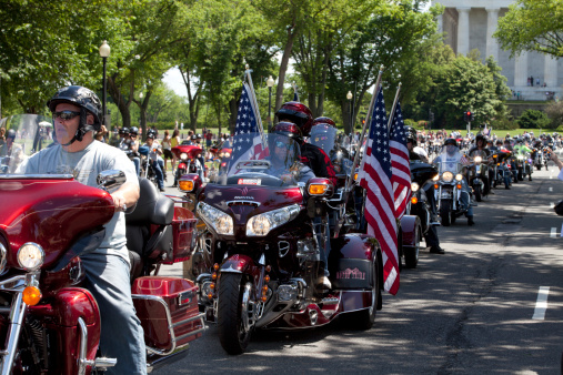 Washington DC, USA - May 25, 2014: Large group of motorcycles looping around the Mall in Washington DC as part of the annual Rolling Thunder motorcycle “Ride for Freedom” for American POWs and MIA soldiers.