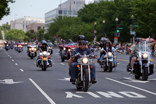 Washington DC, USA - May 25, 2014: Large group of motorcycles looping around the Mall in Washington DC as part of the annual Rolling Thunder motorcycle “Ride for Freedom” for American POWs and MIA soldiers.