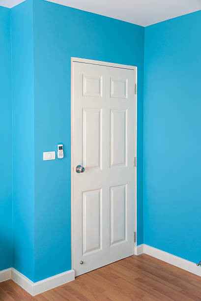 istock Blue wall and wooden floor with white door, empty room 494632974