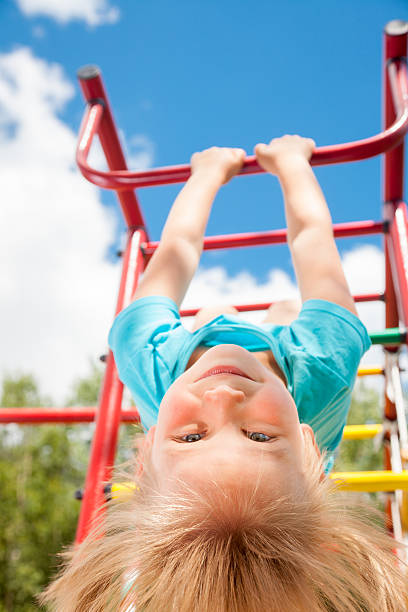 istock Happy child on a jungle gym 494633414