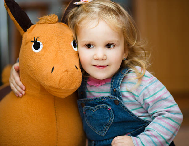 istock Little girl playing with toys 494634802