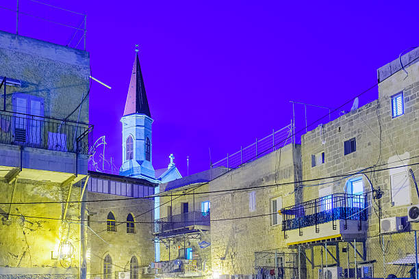 Tel Aviv -Yafo, Israel, July 08, 2016: Old Clock Tower at night in old city Yafo, Israel. It's limestone clock tower built in 1903 to honor one of the last sultans of the Ottoman Empire.