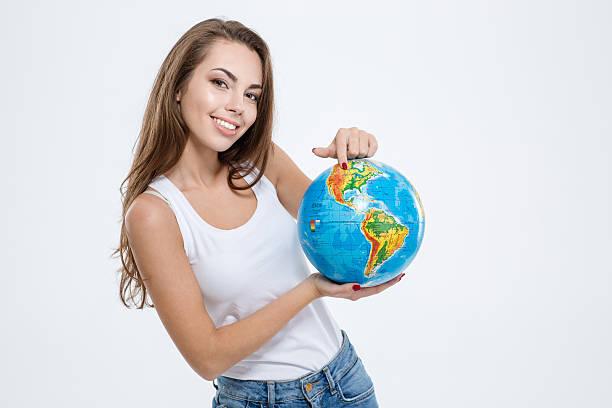 istock Happy cute woman holding globe 494635312