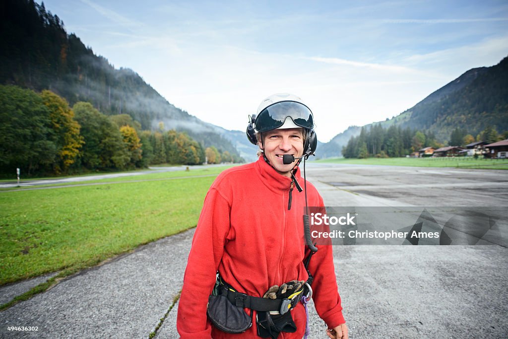 Helicopter Mountain Rescue Paramedic at Aerodrome A helicopter mountain rescue paramedic standing on the runway of an aerodrome in the Swiss Alps, Bernese Oberland region. Portrait Stock Photo