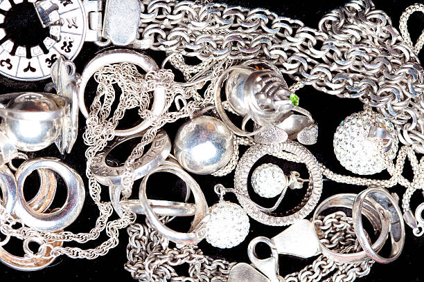 istock Silver jewlery on black background 494637036