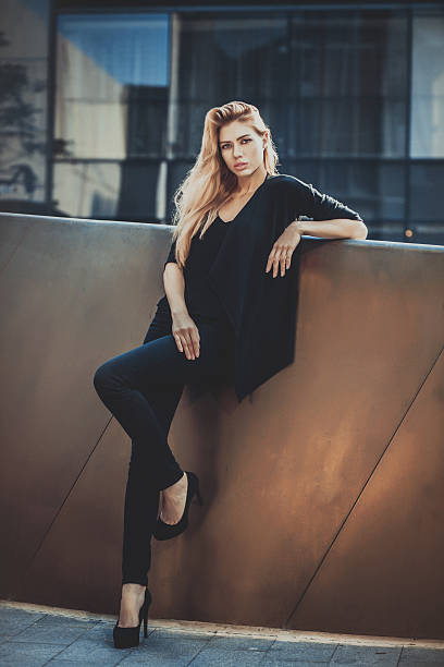 istock Beautiful young model woman posing in modern architecture environment. 494638816