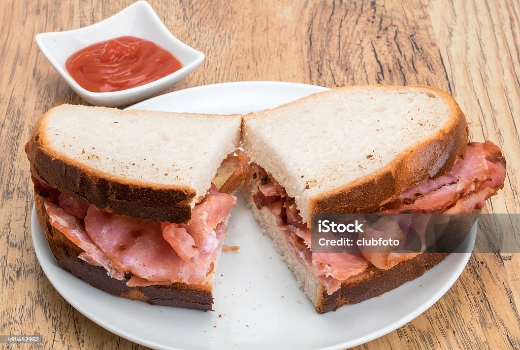 Bacon sandwich Crispy bacon inside a crusty bread sandwich Bacon Stock Photo