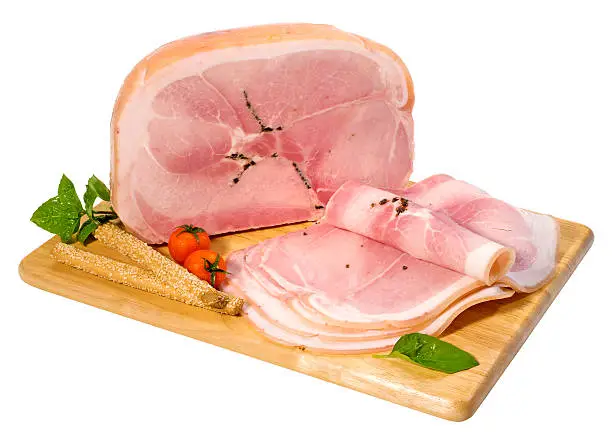 Delicious cooked ham with truffle on a cutting board,isolated on white with clipping path.