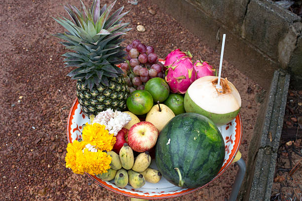 istock pineapple watermelon apple etc. in a tray setting to pray 494645906