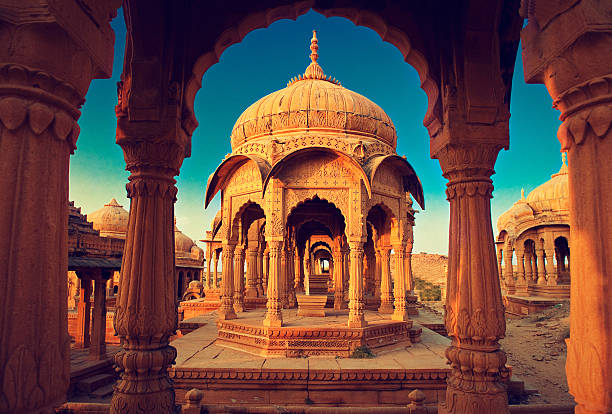 India,Bada Bagh cenotaph in Jaisalmer, Rajasthan The royal cenotaphs, also known as Jaisalmer Chhatris, at Bada Bagh in Jaisalmer. Made of yellow sandstone at sunset jainism photos stock pictures, royalty-free photos & images