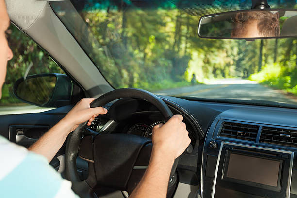 istock Driving man sitting inside the car  in Redwood, US 494661176
