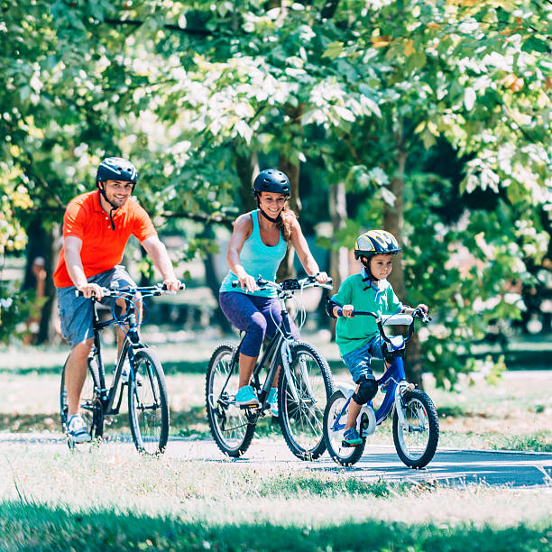 istock Beautiful family riding bicycles 494662574