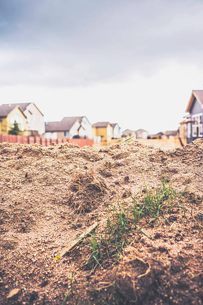 istock Waste land on lot between new construction homes 494665720