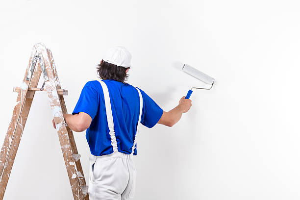 istock Painter man at work climbing a vintage wooden ladder 494670226