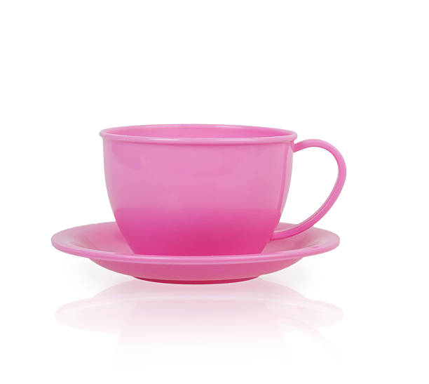 istock pink plastic toy cup and saucer 494671566