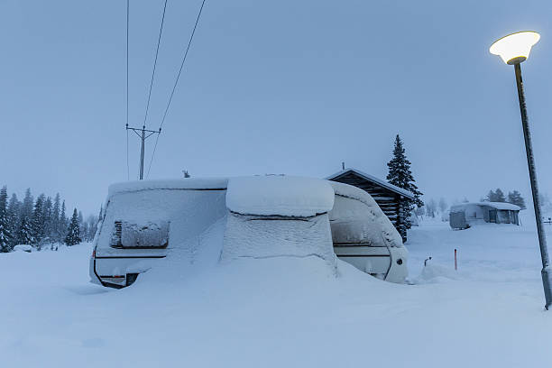 istock mobile caravan camper buried in winter snow 494673233